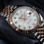 Rolex Datejust 41mm 126331 case side profile showing everose gold fluted bezel and steel case